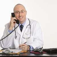 This is a picture of a doctor talking on the phone.